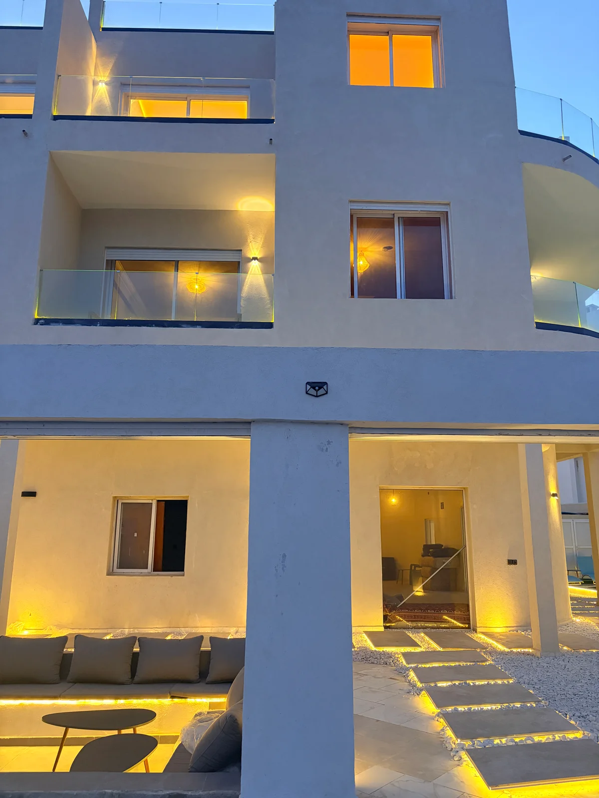 The facade · lit windows